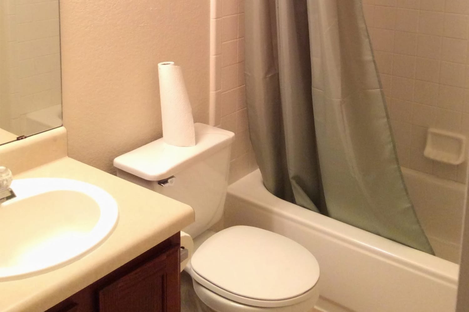 How to Make a Boring Beige Bath Pretty in Pink with a Bathroom